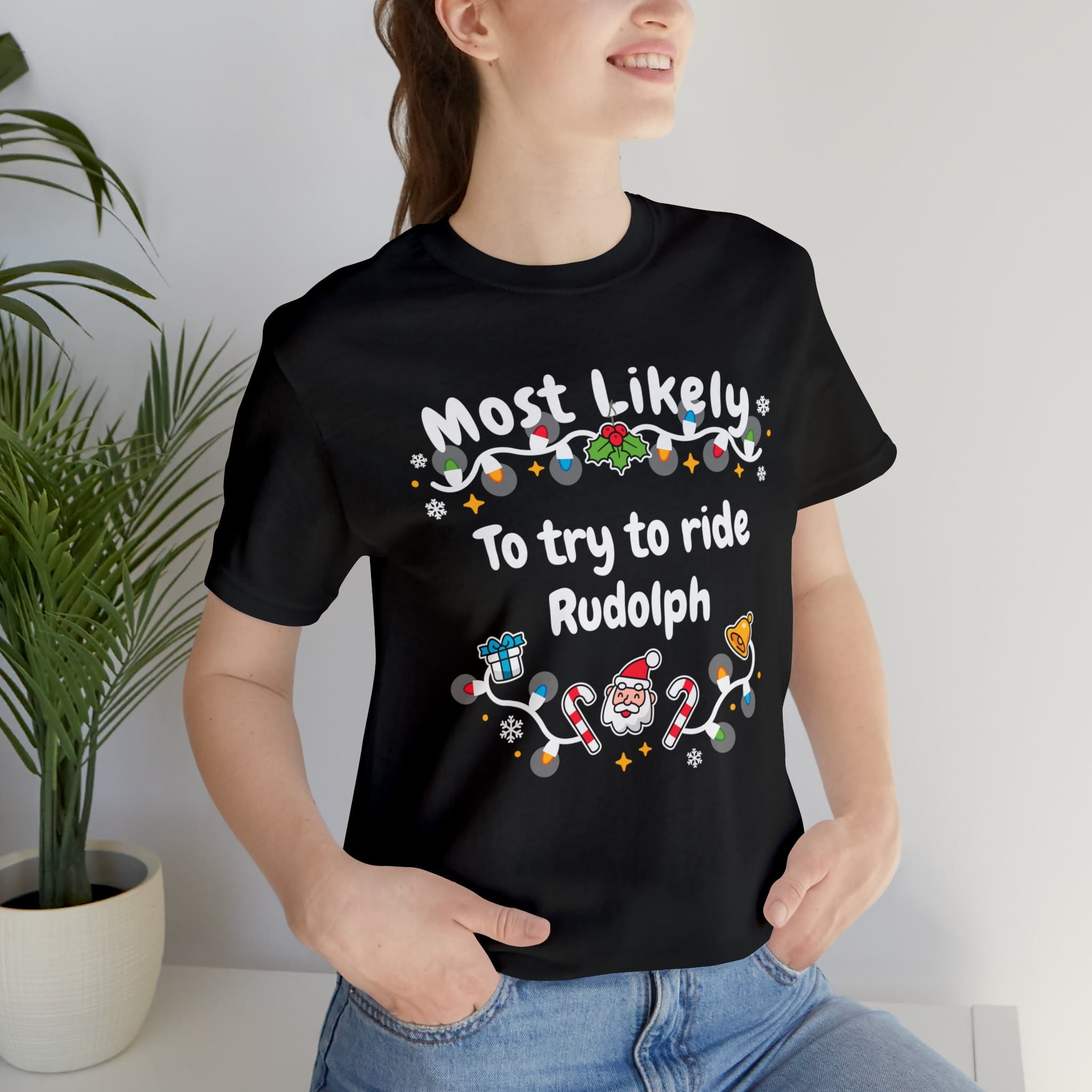 Most Likely To try To Ride Rudolph Unisex Deluxe Tee