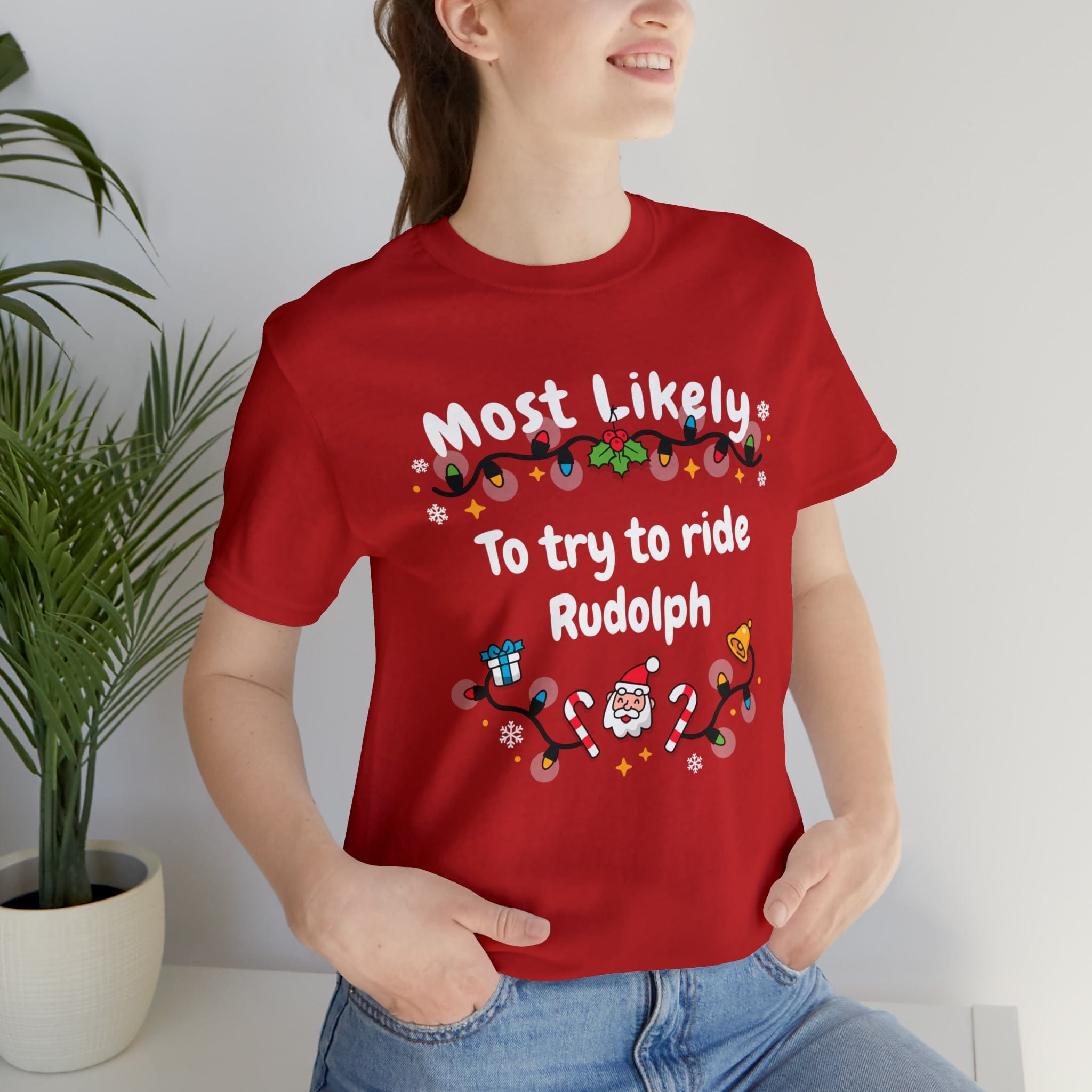 Most Likely To try To Ride Rudolph Unisex Deluxe Tee